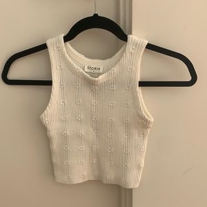White Storia tank top with flowers on it